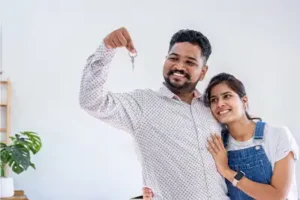 Indian Couple Holding Keys to their New House
