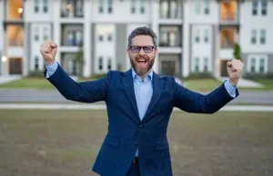 Successful Real Estate Investor Celebrating Property Sale